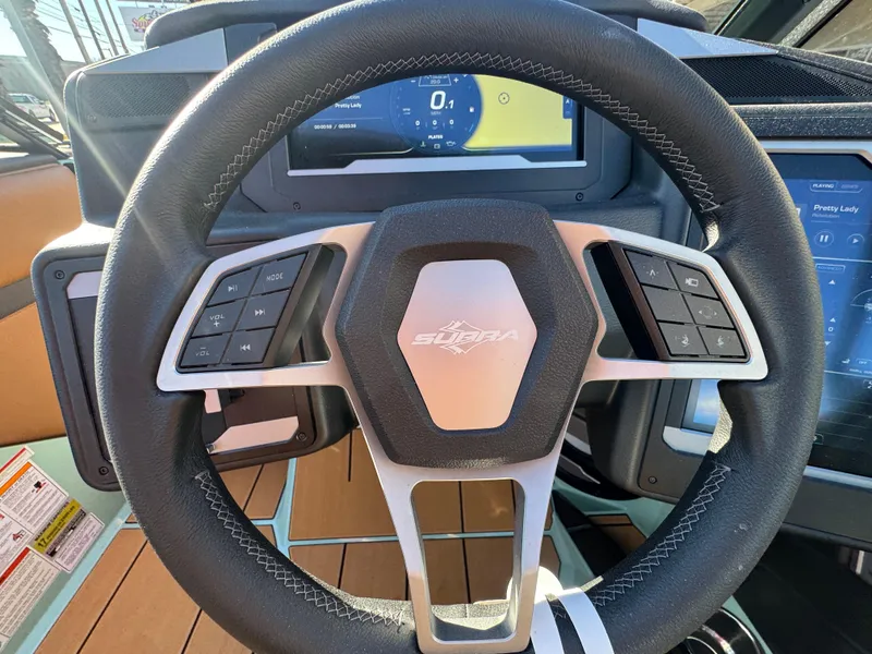 Slide: The Image of Steering wheel of 2025 Supra SL 450 with digital dashboard and control buttons. - 42