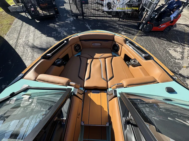 Slide: The Image of 2025 Supra SL 450 boat interior with tan leather seating and modern design. - 48
