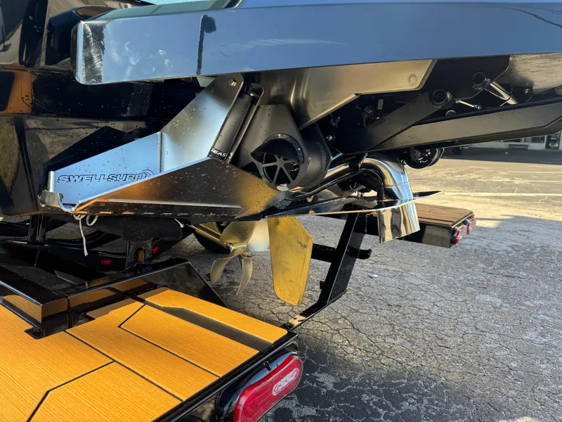 Slide: The Image of 2025 Supra SL 450 boat propeller and stern detail on trailer. - 9