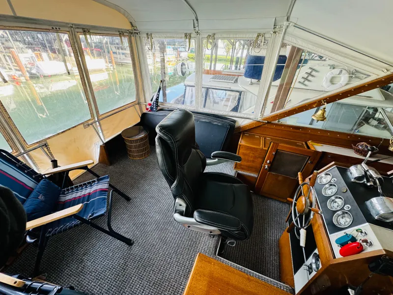 Slide: The Image of 1965 Chris-Craft 38 Constellation boat interior with helm, seating, and control panel. - 25