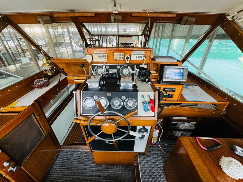 Slide: The Image of 1965 Chris-Craft 38 Constellation boat cockpit with vintage controls and wooden interior. - 26