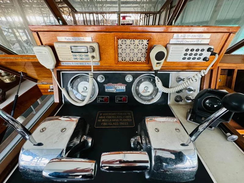 Slide: The Image of 1965 Chris-Craft 38 Constellation helm with vintage controls and communication devices. - 30
