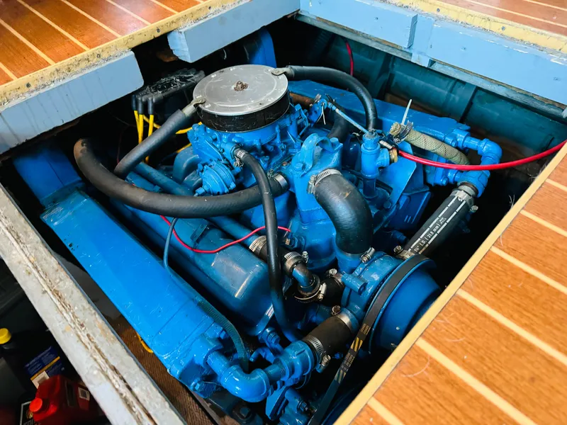 Slide: The Image of 1965 Chris-Craft 38 Constellation engine, blue, exposed in wooden deck compartment. - 33