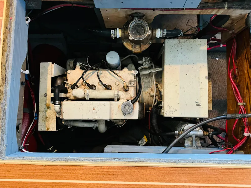 Slide: The Image of Engine compartment of a 1965 Chris-Craft 38 Constellation boat, showcasing mechanical components. - 35