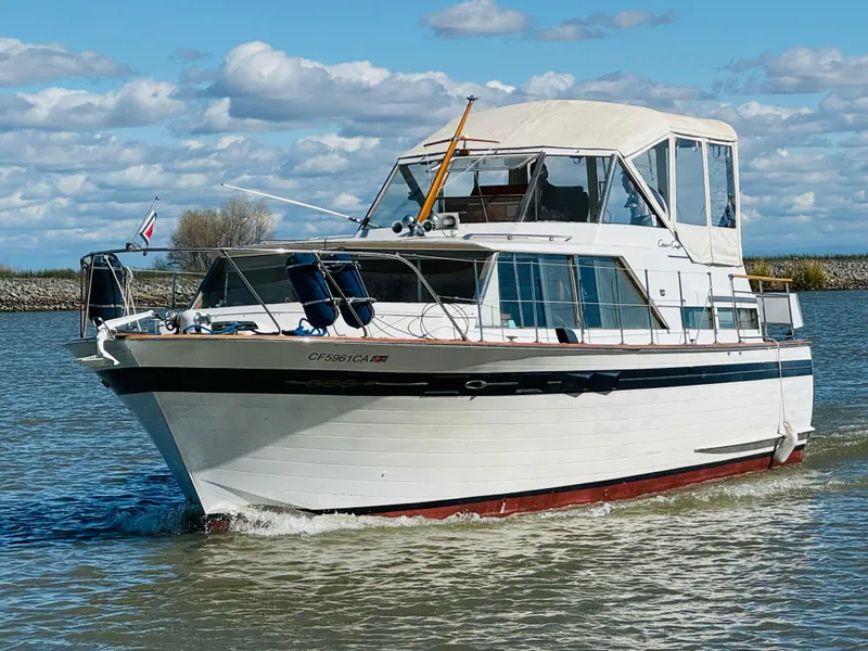 Slide: The Image of 1965 Chris-Craft 38 Constellation yacht cruising on a sunny day with blue skies. - 4