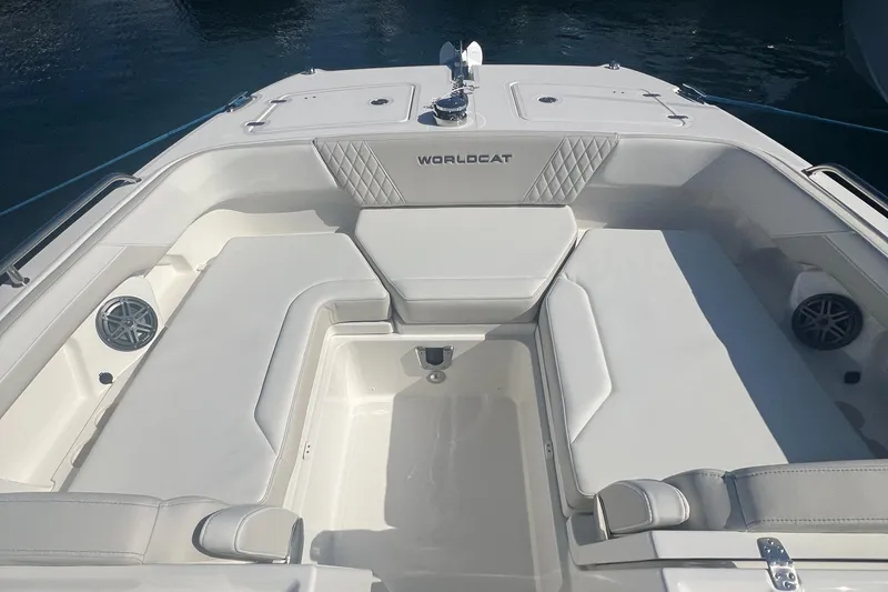 Slide: The Image of 2024 World Cat 260 DC-X boat interior with white seating and speakers. - 5