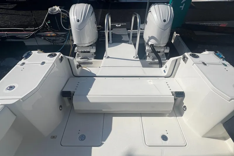 Slide: The Image of 2024 World Cat 260 DC-X boat with dual engines and spacious deck layout. - 6
