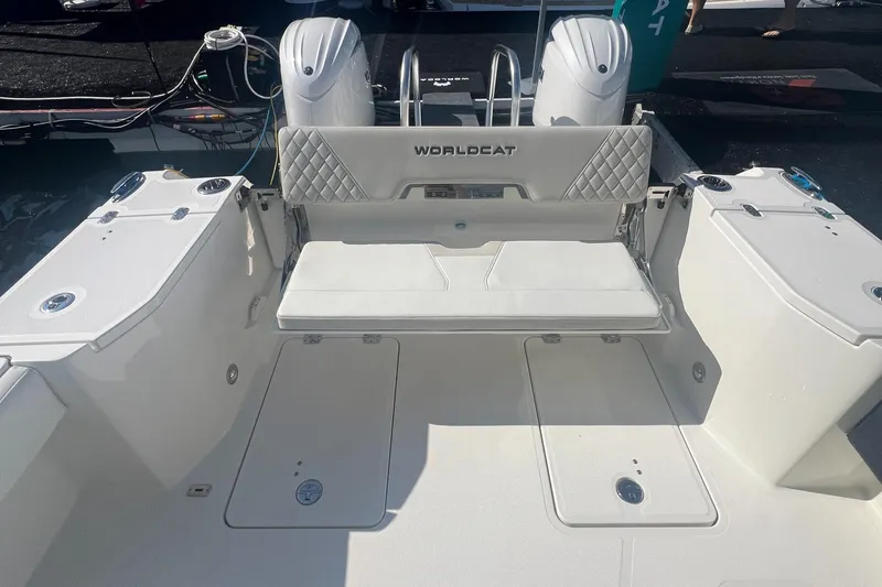 Slide: The Image of 2024 World Cat 260 DC-X boat interior with dual engines and seating area. - 7