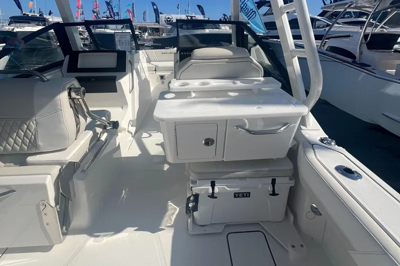 Slide: The Image of 2024 World Cat 260 DC-X interior with seating, storage, and Yeti cooler. - 8