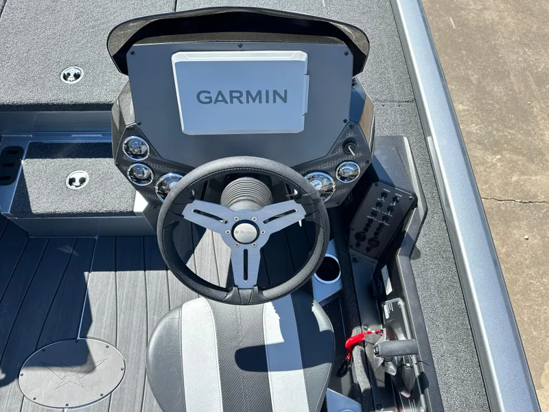 Slide: The Image of 2025 Vexus AVX 1895S boat dashboard with Garmin navigation system and steering wheel. - 5