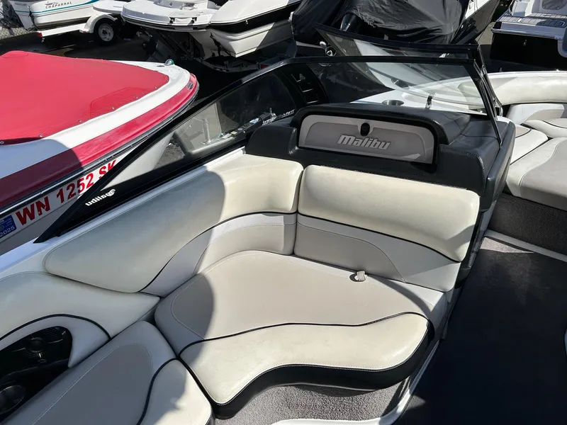 Slide: The Image of 2013 Malibu Wakesetter 20 VTX boat interior with white and black seating. - 10
