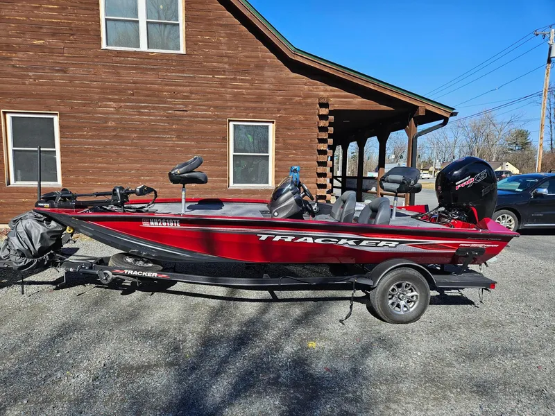 The Image of 2022 Tracker Pro Team 195 TXW Tournament Edition boat parked on gravel driveway. - 0