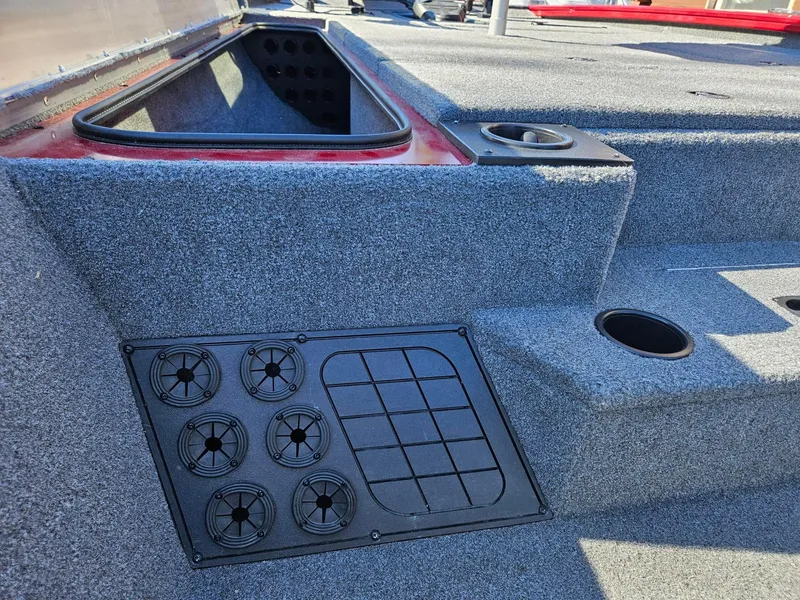 Slide: The Image of 2022 Tracker Pro Team 195 TXW Tournament Edition boat interior with storage and cup holders. - 12