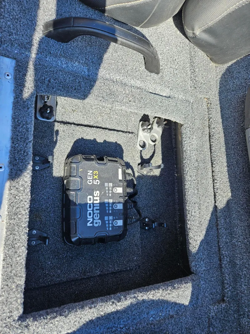 Slide: The Image of Battery compartment of 2022 Tracker Pro Team 195 TXW Tournament Edition with NOCO Genius 5X3 charger. - 21