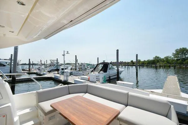 Slide: The Image of Luxury yacht Prestige 460S 2019 at marina with spacious seating area. - 15