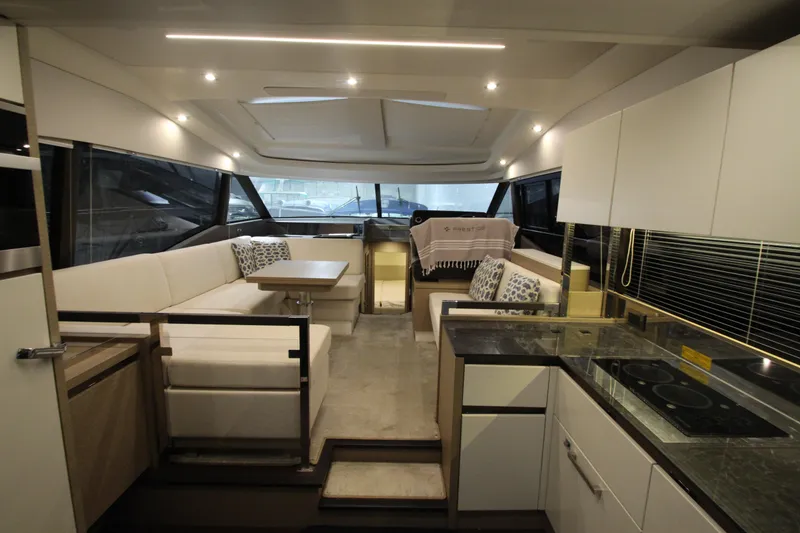 Slide: The Image of Luxurious interior of a 2019 Prestige 460S yacht with modern kitchen and seating area. - 25