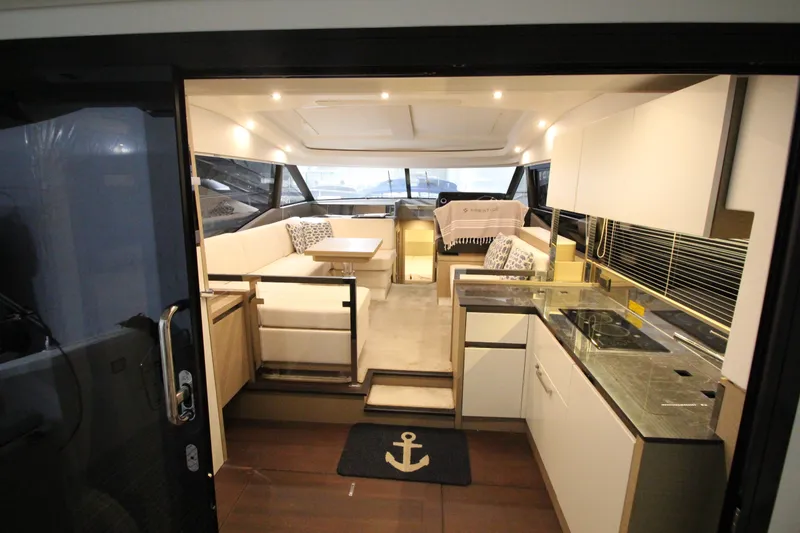 Slide: The Image of Luxurious interior of 2019 Prestige 460S yacht with modern kitchen and seating area. - 26