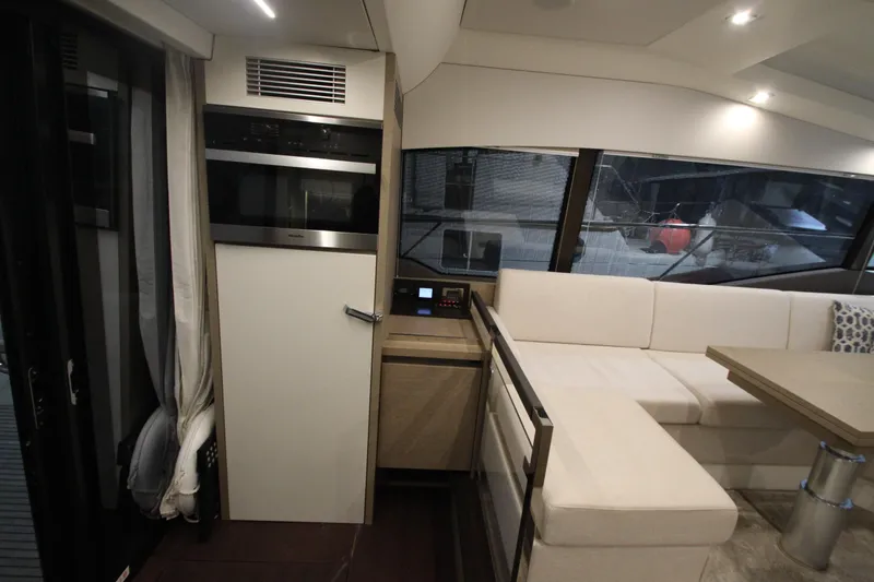 Slide: The Image of Interior of 2019 Prestige 460S yacht with modern seating and sleek design. - 28