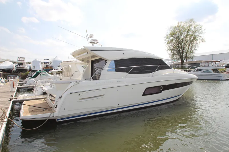 Slide: The Image of 2019 Prestige 460S yacht docked at a marina, side view. - 3