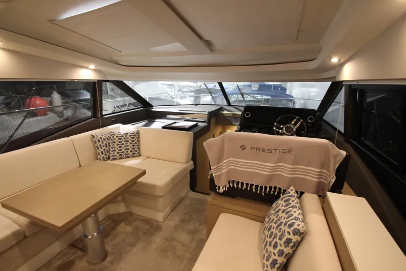 Slide: The Image of Luxurious interior of 2019 Prestige 460S yacht with elegant seating and helm station. - 34