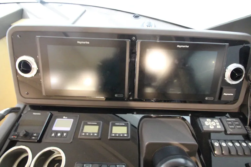 Slide: The Image of Control panel of 2019 Prestige 460S yacht with dual Raymarine displays. - 37