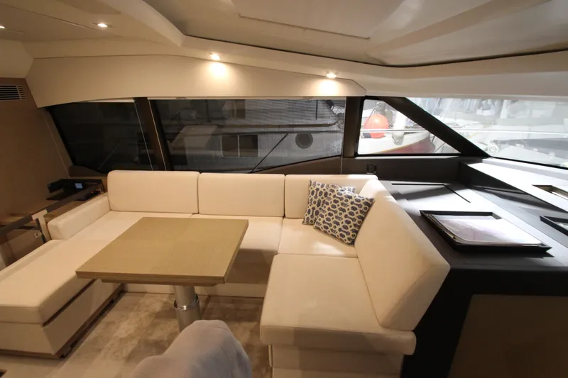 Slide: The Image of Luxurious interior of 2019 Prestige 460S yacht with elegant white seating and modern design. - 40