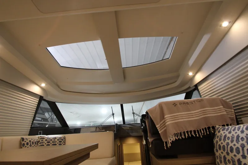 Slide: The Image of Interior of 2019 Prestige 460S yacht with skylights and elegant seating. - 46