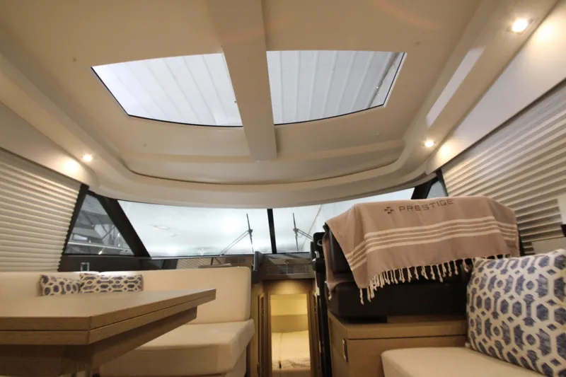 Slide: The Image of Luxurious interior of a 2019 Prestige 460S yacht with elegant seating and skylights. - 47