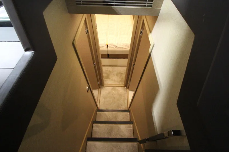 Slide: The Image of Stairway inside 2019 Prestige 460S yacht, leading to cabin area. - 48
