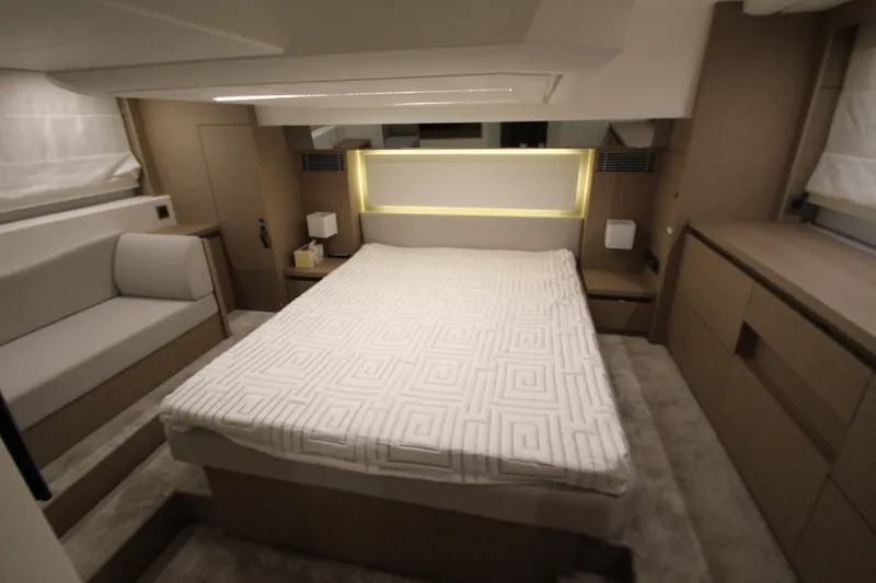 Slide: The Image of Luxurious bedroom interior of 2019 Prestige 460S yacht with modern design and ambient lighting. - 50