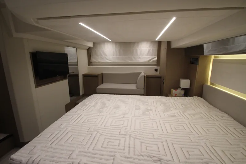 Slide: The Image of Luxurious interior of 2019 Prestige 460S yacht with modern lighting and elegant bedding. - 52
