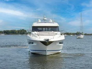 Slide: The Image of 2019 Prestige 460S yacht cruising on a calm lake under a clear blue sky. - 9