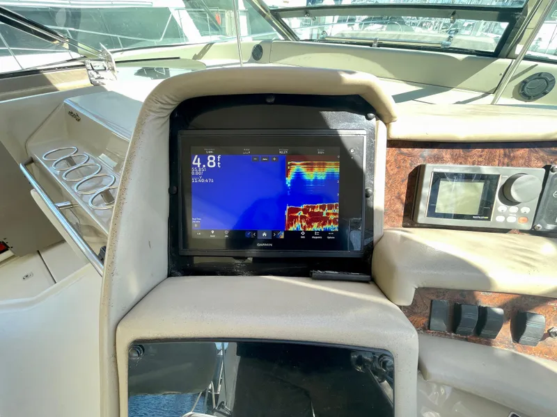 Slide: The Image of Control panel of a 1999 Sea Ray 500 Sundancer yacht with navigation display. - 30