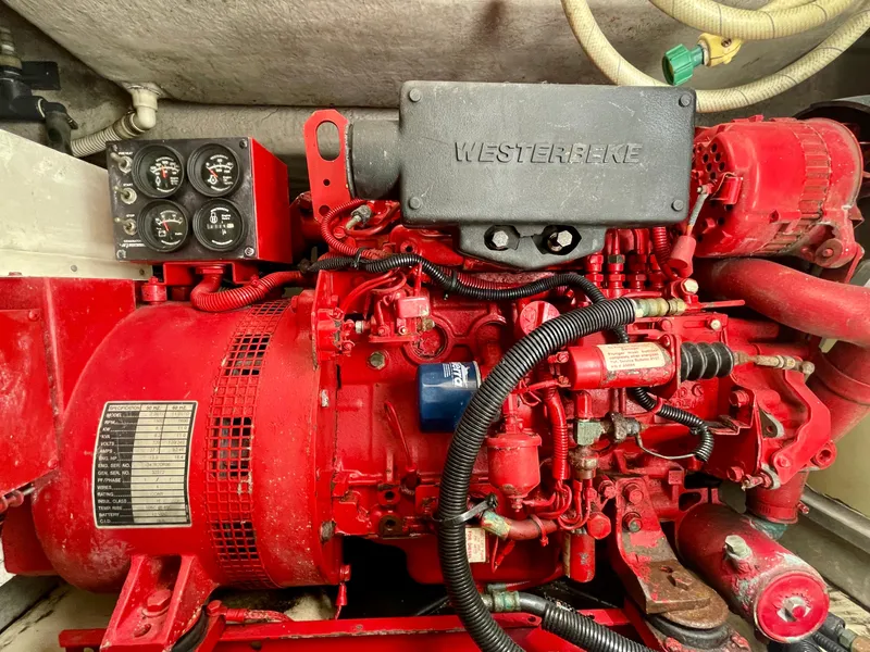 Slide: The Image of Engine compartment of a 1999 Sea Ray 500 Sundancer with Westerbeke generator. - 44