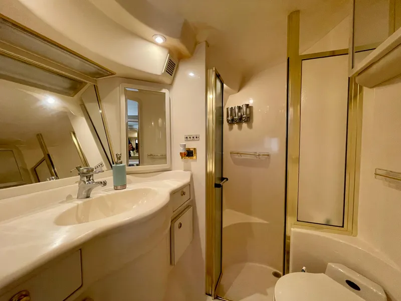Slide: The Image of Luxurious bathroom in 1999 Sea Ray 500 Sundancer yacht with modern fixtures and shower. - 7