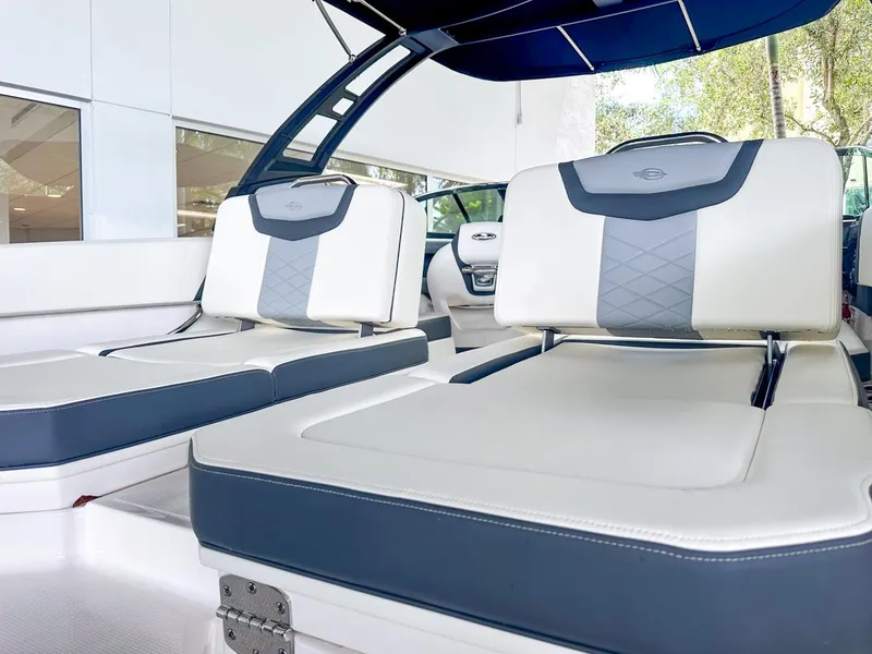Slide: The Image of 2024 Chaparral 250 OSX OB boat interior with luxurious seating and modern design. - 10