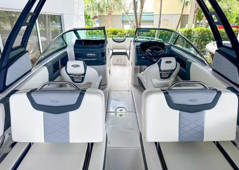 Slide: The Image of 2024 Chaparral 250 OSX OB boat interior with modern seating and sleek design. - 11