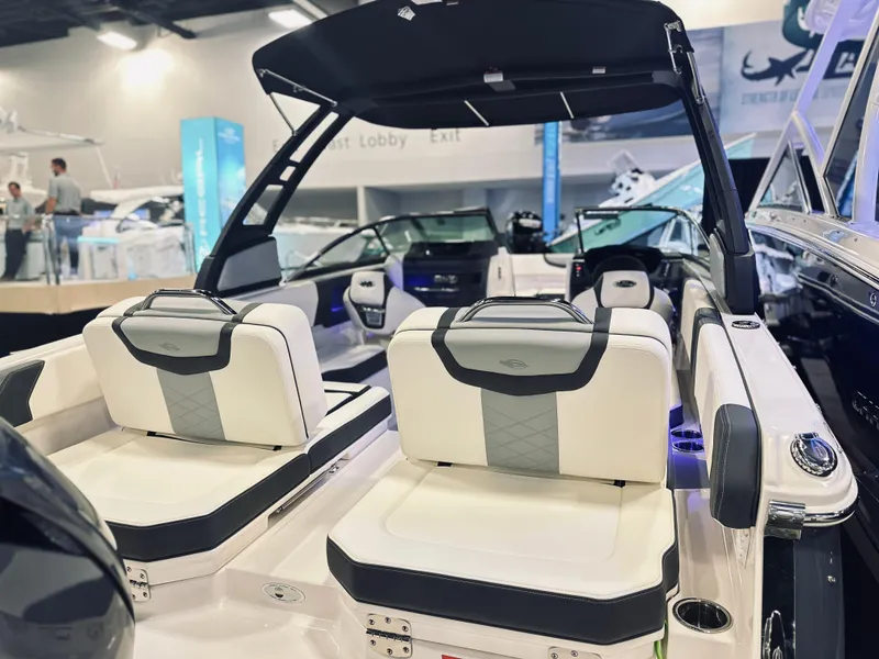 Slide: The Image of 2024 Chaparral 250 OSX OB boat interior with modern seating and sleek design. - 12