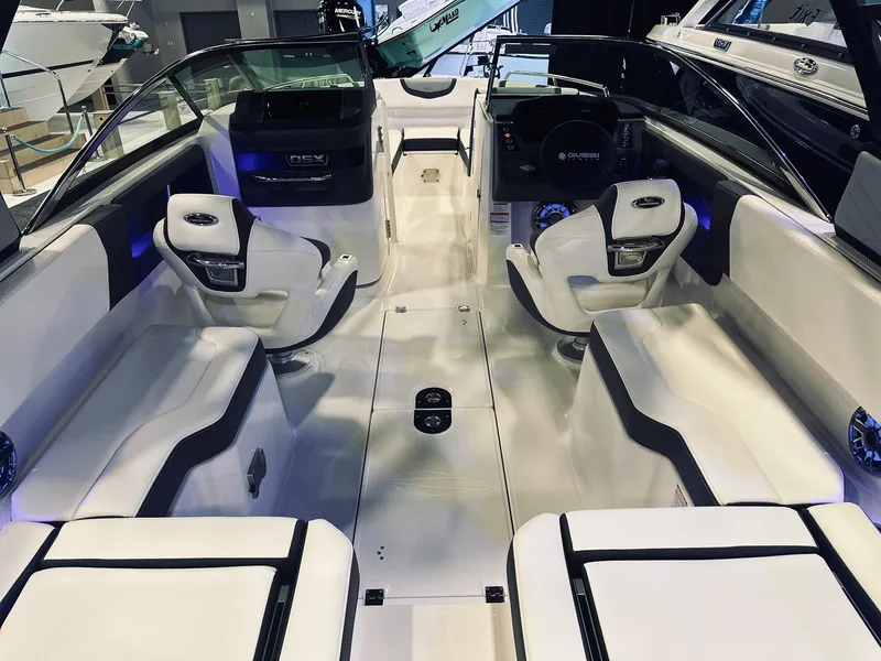 Slide: The Image of 2024 Chaparral 250 OSX OB boat interior with sleek seating and modern design. - 13