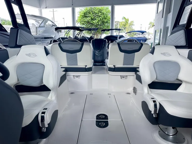 Slide: The Image of 2024 Chaparral 250 OSX OB boat interior with luxurious seating and modern design. - 17