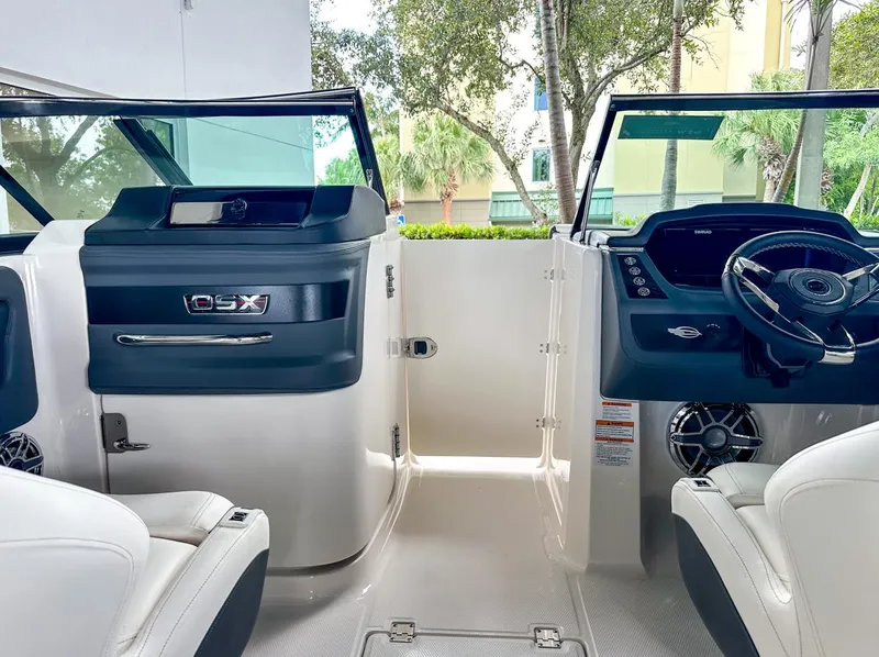 Slide: The Image of 2024 Chaparral 250 OSX OB boat interior with modern dashboard and seating. - 18