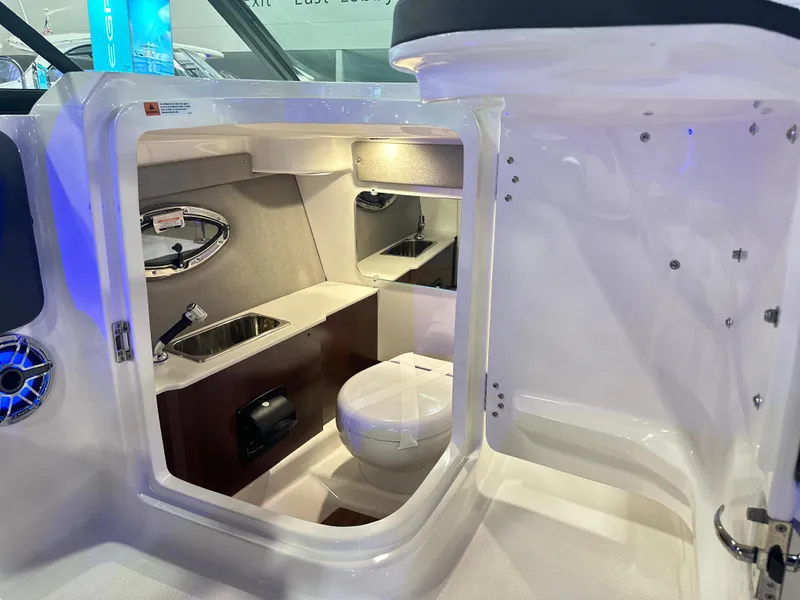Slide: The Image of 2024 Chaparral 250 OSX OB boat interior with sink and toilet. - 26