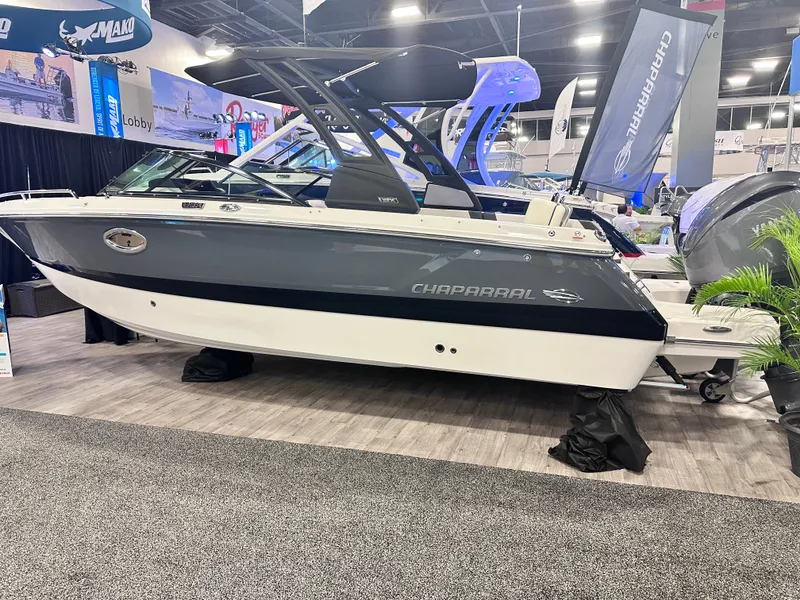 Slide: The Image of 2024 Chaparral 250 OSX OB boat displayed at an indoor exhibition. - 3