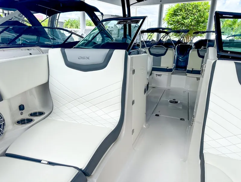 Slide: The Image of 2024 Chaparral 250 OSX OB boat interior with modern seating and sleek design. - 36