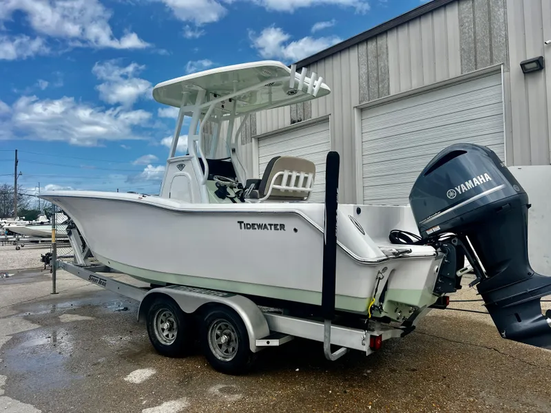 The Image of 2019 Tidewater 232 CC Adventure boat on trailer with Yamaha outboard motor. - 1