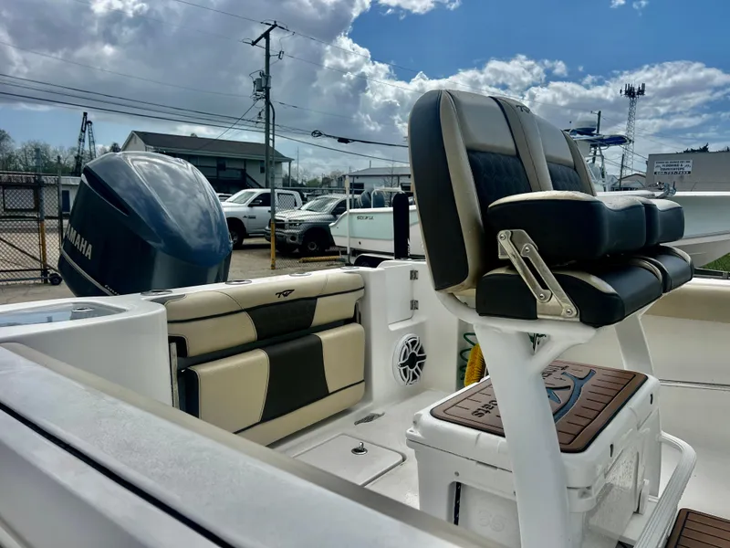 Slide: The Image of 2019 Tidewater 232 CC Adventure boat interior with seating and Yamaha engine. - 12