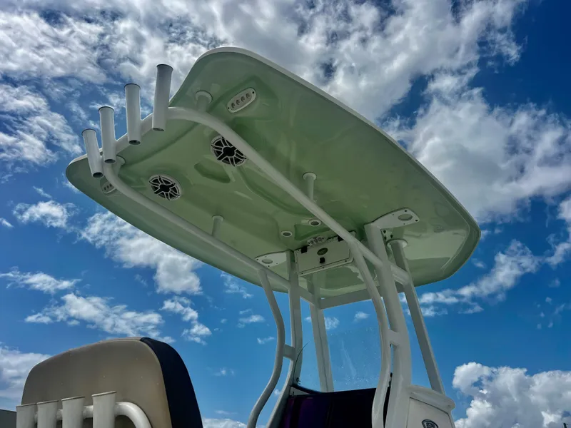 Slide: The Image of Tidewater 232 CC Adventure 2019 boat top against a cloudy blue sky. - 15