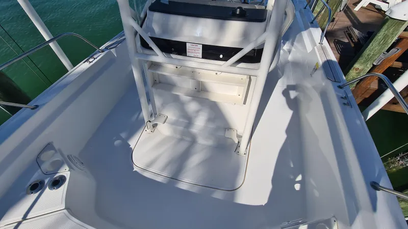 Slide: The Image of 2019 Boston Whaler 210 Montauk boat interior with seating and console. - 14
