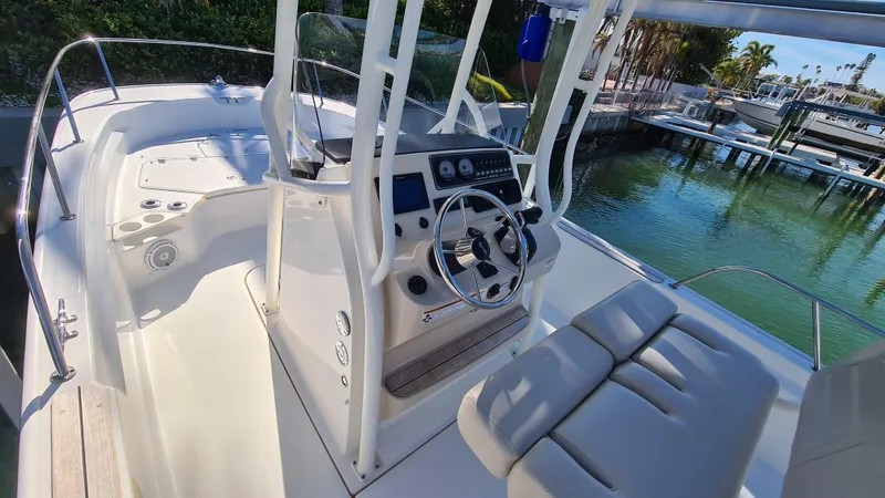 Slide: The Image of 2019 Boston Whaler 210 Montauk boat interior with steering console and seating. - 16