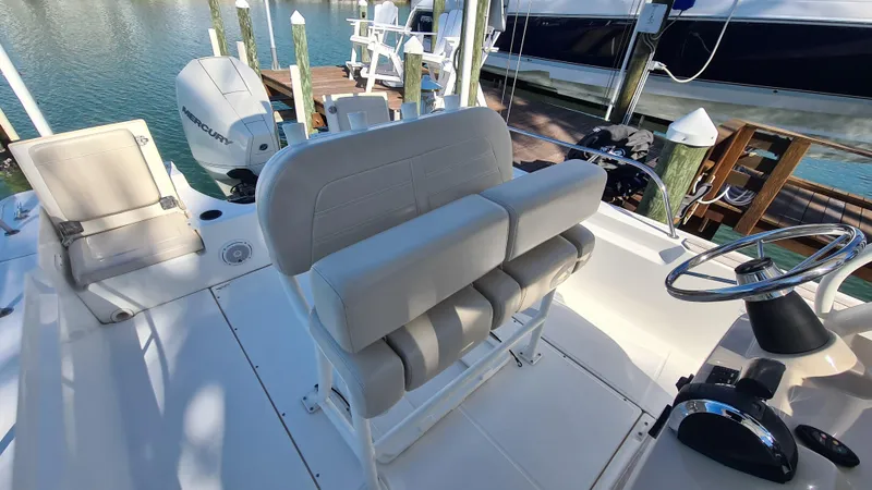 Slide: The Image of 2019 Boston Whaler 210 Montauk boat interior with seating and steering wheel. - 26